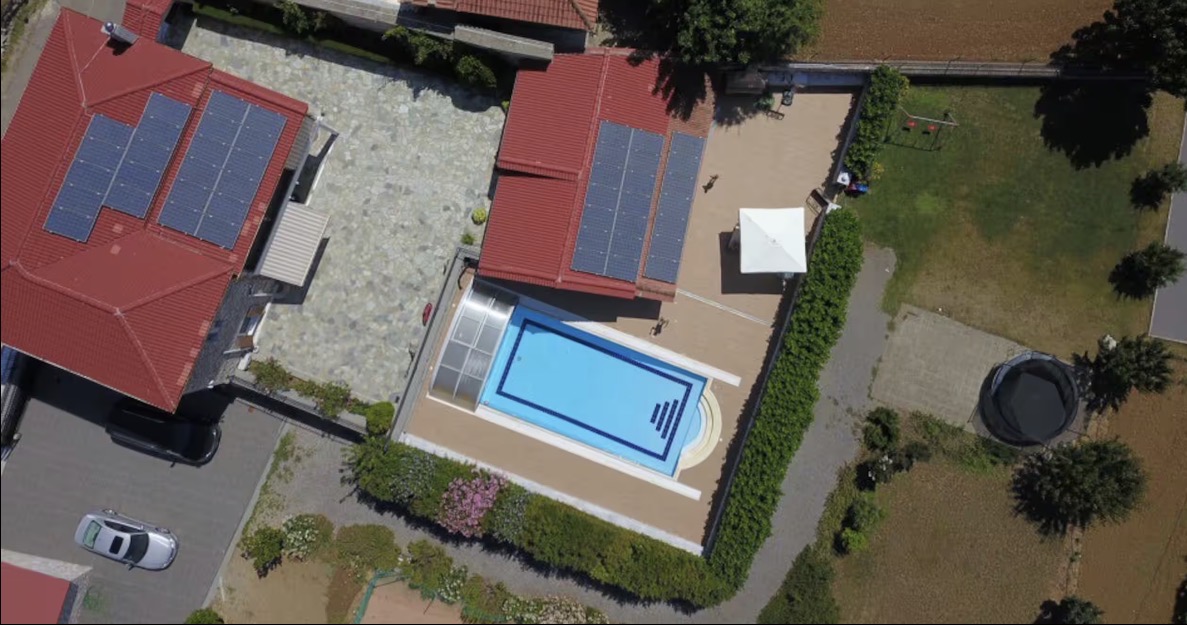 Aerial drone view of the 6 by 12 metre heated pool with retractable enclosure at Villa Arcadia